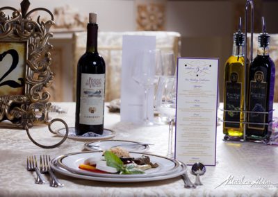 a wedding menu on a table with some food and drinks