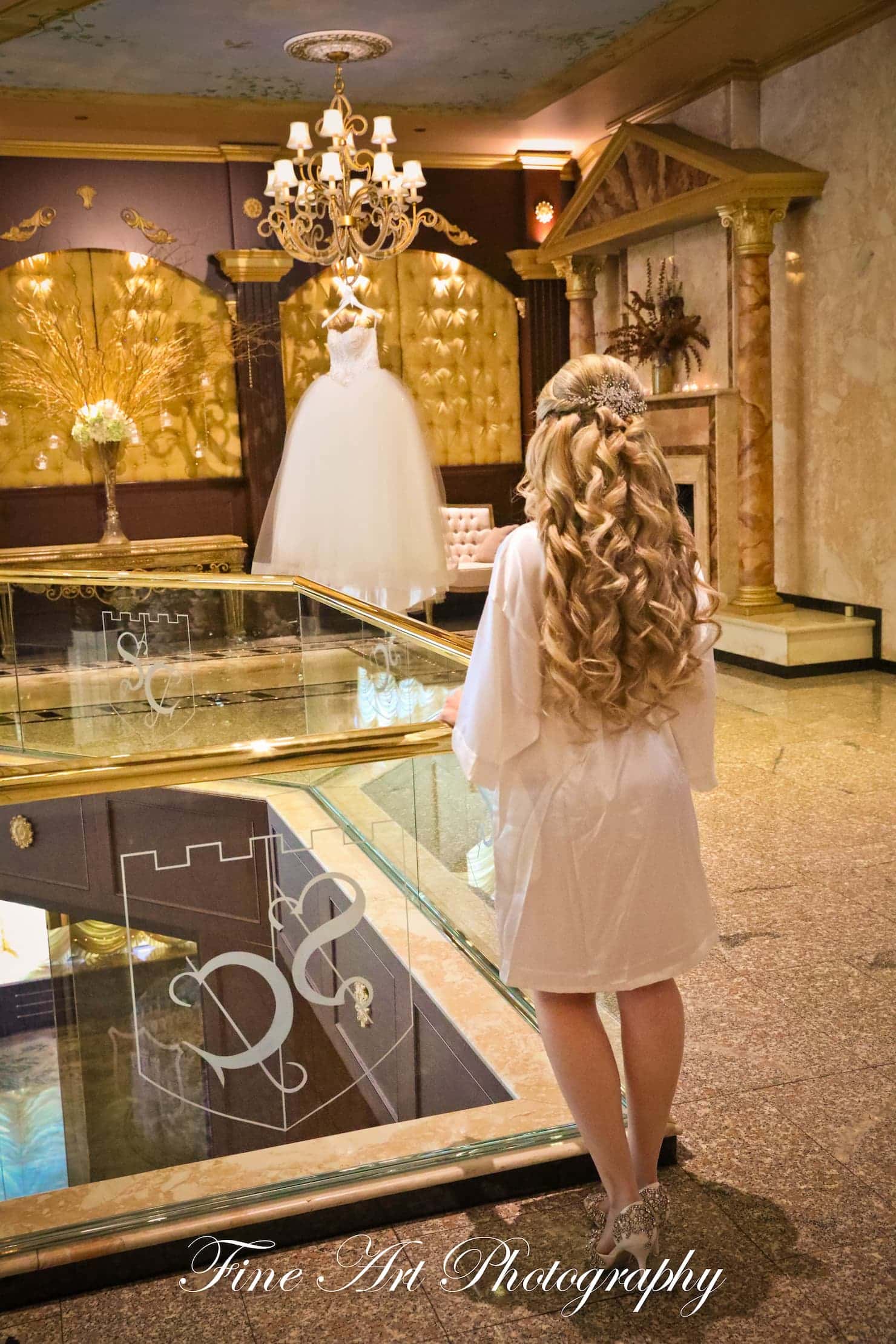 a bride looking at a wedding dress